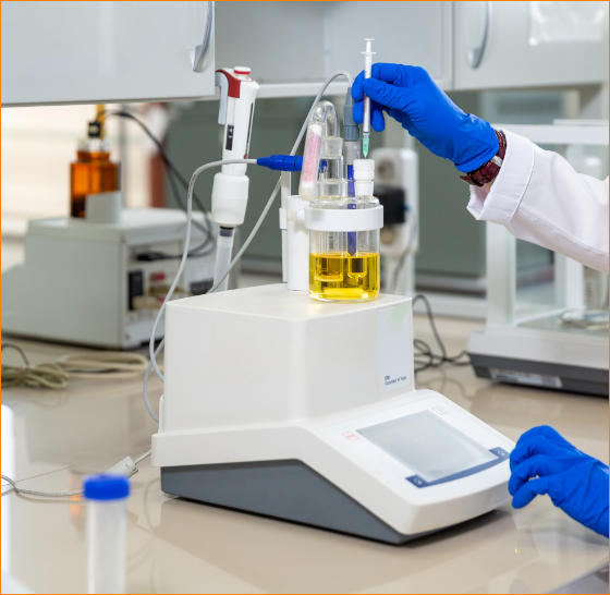 Technician measuring resin moisture by Karl Fischer titration
