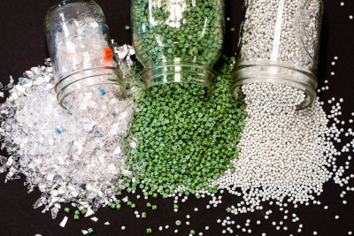 Plastic pellets flowing from containers.